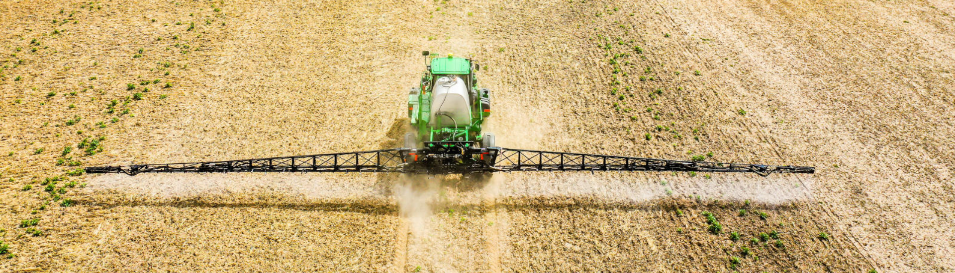 Tractor applying crop nutrients